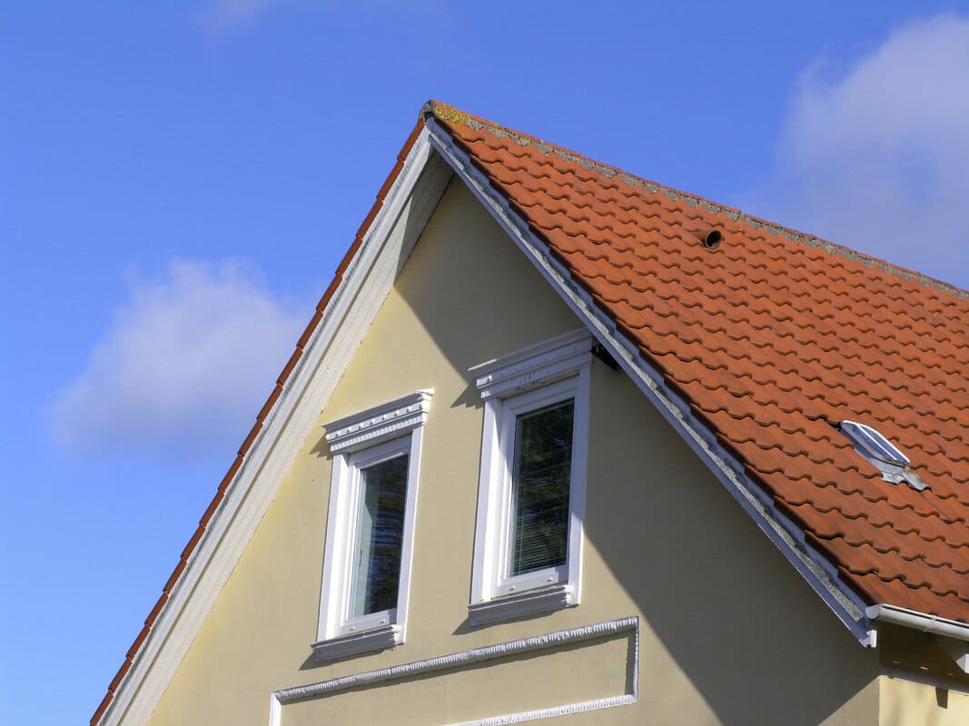 Roof dormer and gable details on a shingle roof